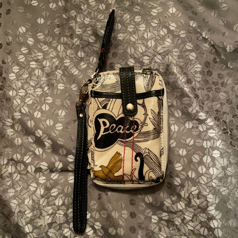 Sakroots wallet/iPhone 12 holder or smaller.